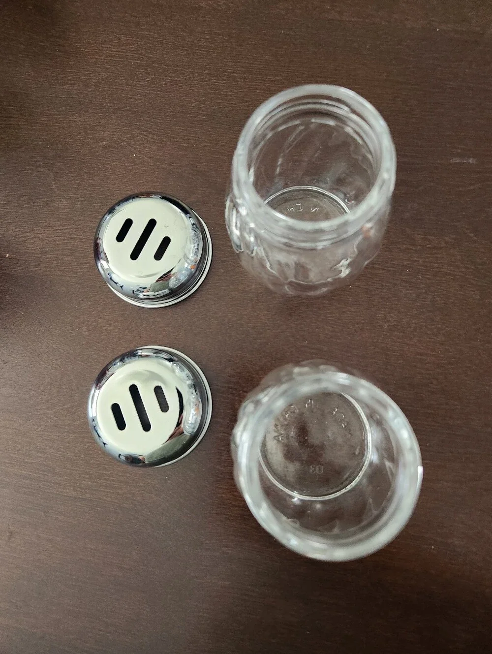 2 TableCraft 6 oz. Swirled glass cheese shakers